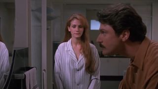 Julia Roberts stands in a bathroom in Sleeping With the Enemy