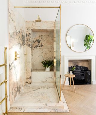 large marble shower enclosure with floor and wall tiles and traditional crown molding victorian home
