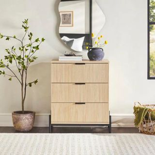 A fluted wood set of three drawers