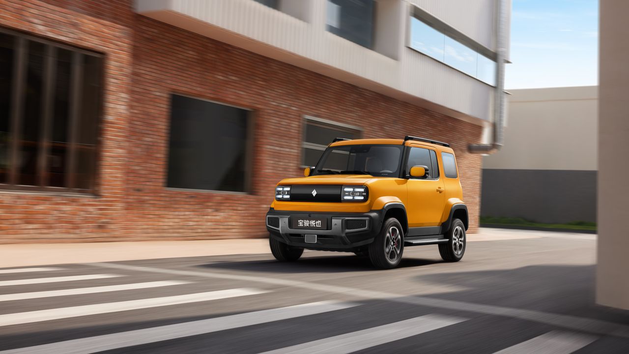 The GM Baojun Yep in yellow, on a city street