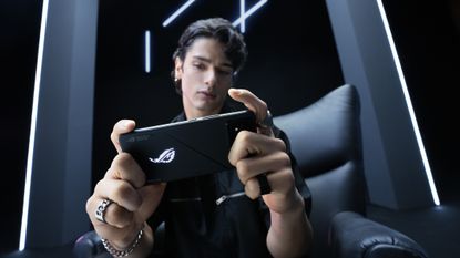A person using the Asus ROG Phone 8 for mobile gaming