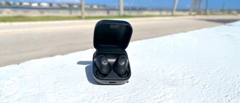 Sennheiser Accentum True Wireless Earbuds on a white wall outside