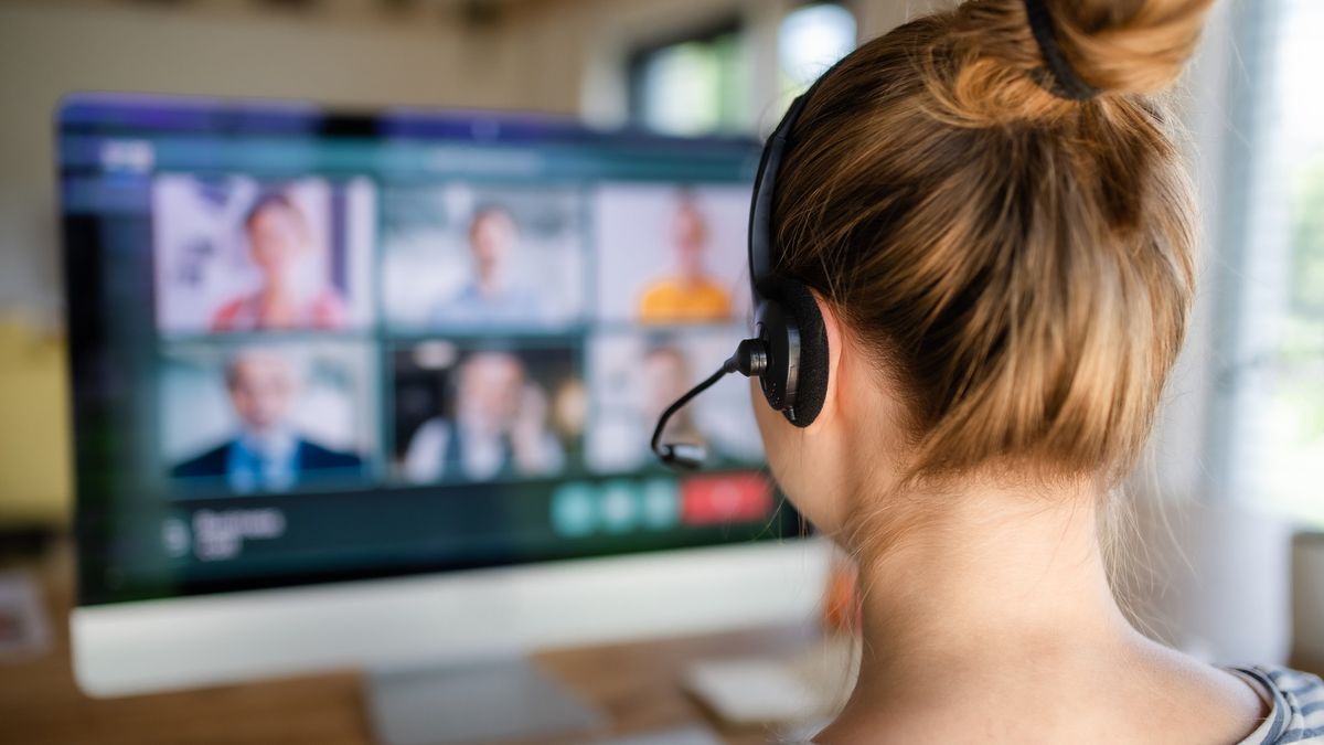 What is VoIP? Example: woman on a VoIP video conference call wearing a VoIP headset