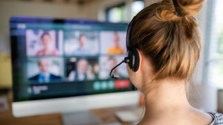 What is VoIP? Example: woman on a VoIP video conference call wearing a VoIP headset