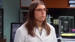 Amy Fowler in her lab talking to Sheldon.