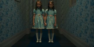 Doctor Sleep The Grady twins standing in the middle of the hallway