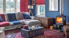 snug room with blue walls and fireplace