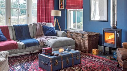 snug room with blue walls and fireplace