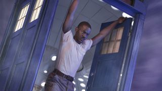 Ncuti Gatwa's Doctor looking out of the TARDIS as it travels through the Time Vortex