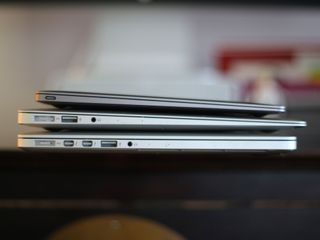 MacBook Air and Pros on top of each other side view