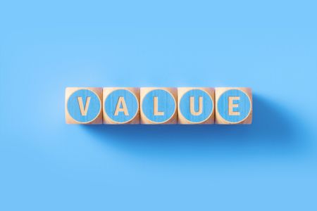 the word "value" written in blue on wooden blocks with blue background