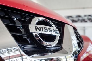 Nissan Logo on a red car