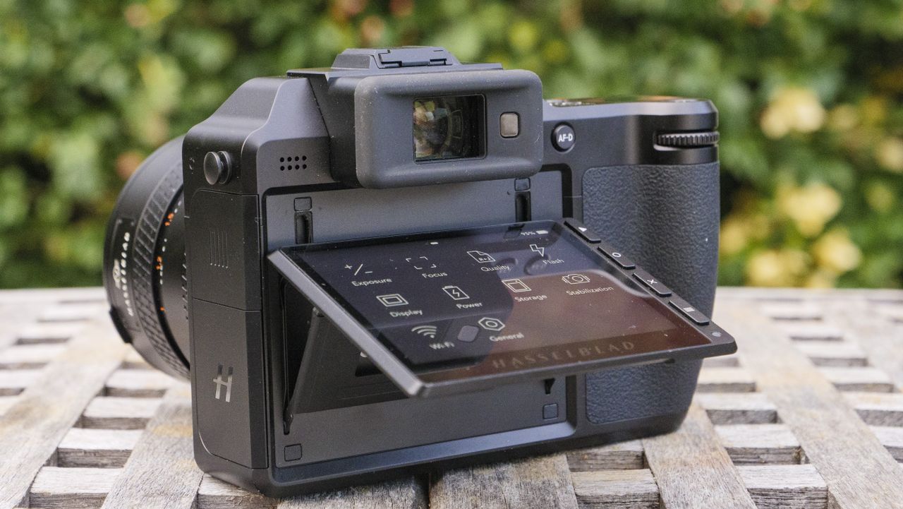 A Hasselblad camera sitting on a garden table