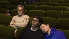 Prada Mode Elmgreen & Dragset installation which features hyper-realistic human figures sitting in a cinema