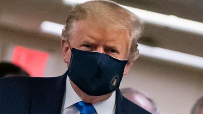 Donald Trump wearing a facemask © ALEX EDELMAN/AFP via Getty Images