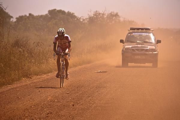 A Belgian rider benefits from the support of a team vehicle.