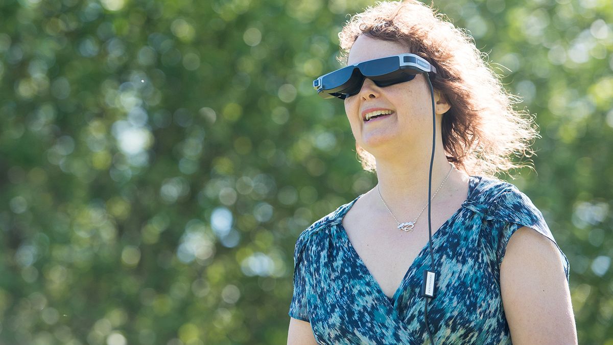 Photo of woman wearing OxSight VR headset