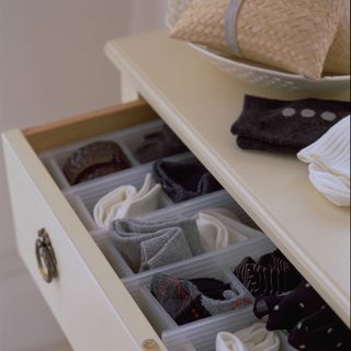 Sock drawer with black white and grey coloured