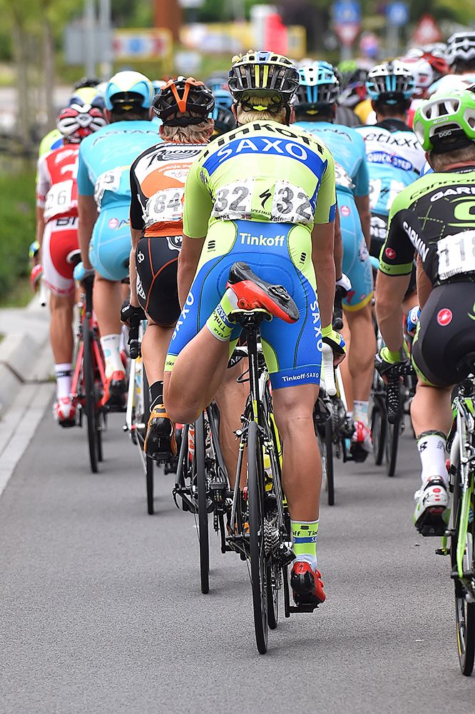 Having a little stretch on the bike during stage 6 a the Eneco Tour