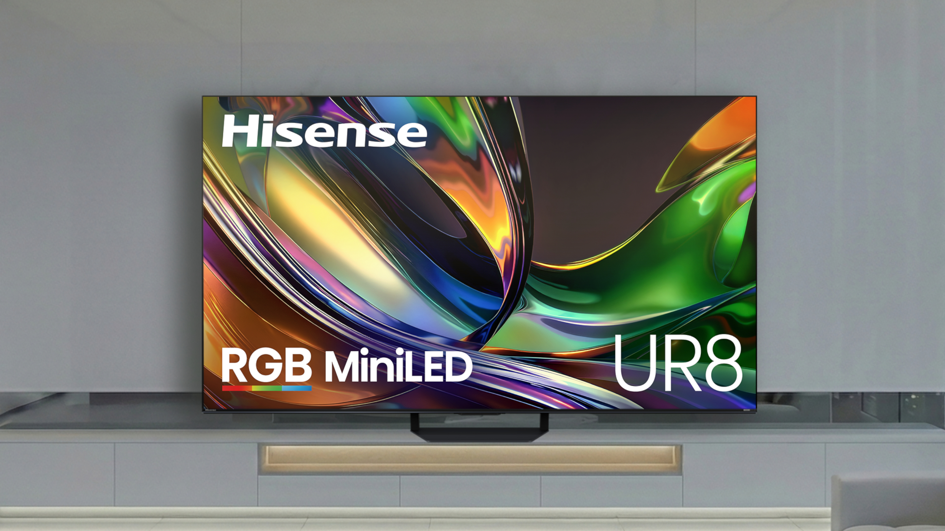 The Hisense UR8 RGB Mini-LED TV displaying colorful, abstract imagery in a modern, monochromatic living space.