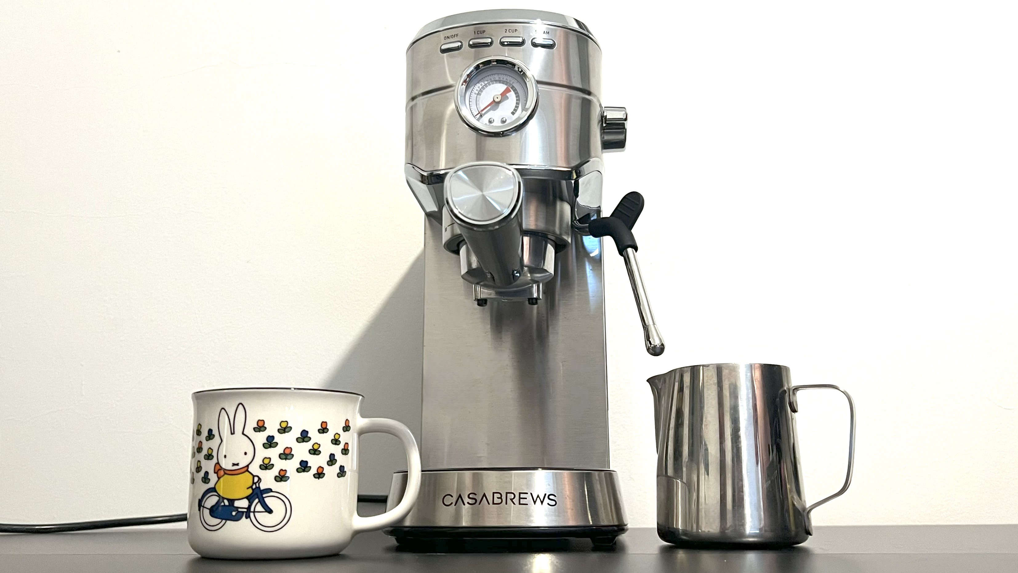 Casabrews CM5418 on kitchen counter with mug and milk jog