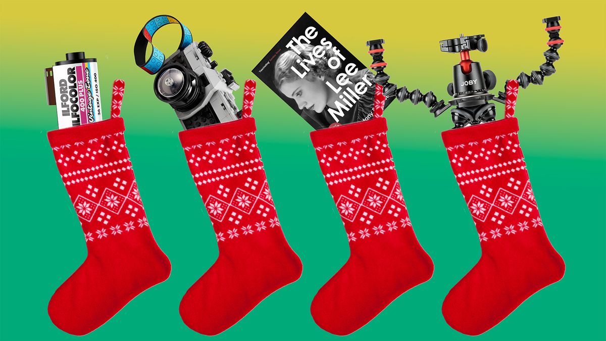 Four Christmas stockings with goodies inside: Ilford 35mm film, Lego Retro Camera, The Lives of Lee Miller book and Joby GorillaPod 