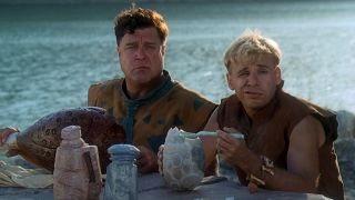 John Goodman and Rick Moranis enjoy lunch at the quarry in The Flintstones.