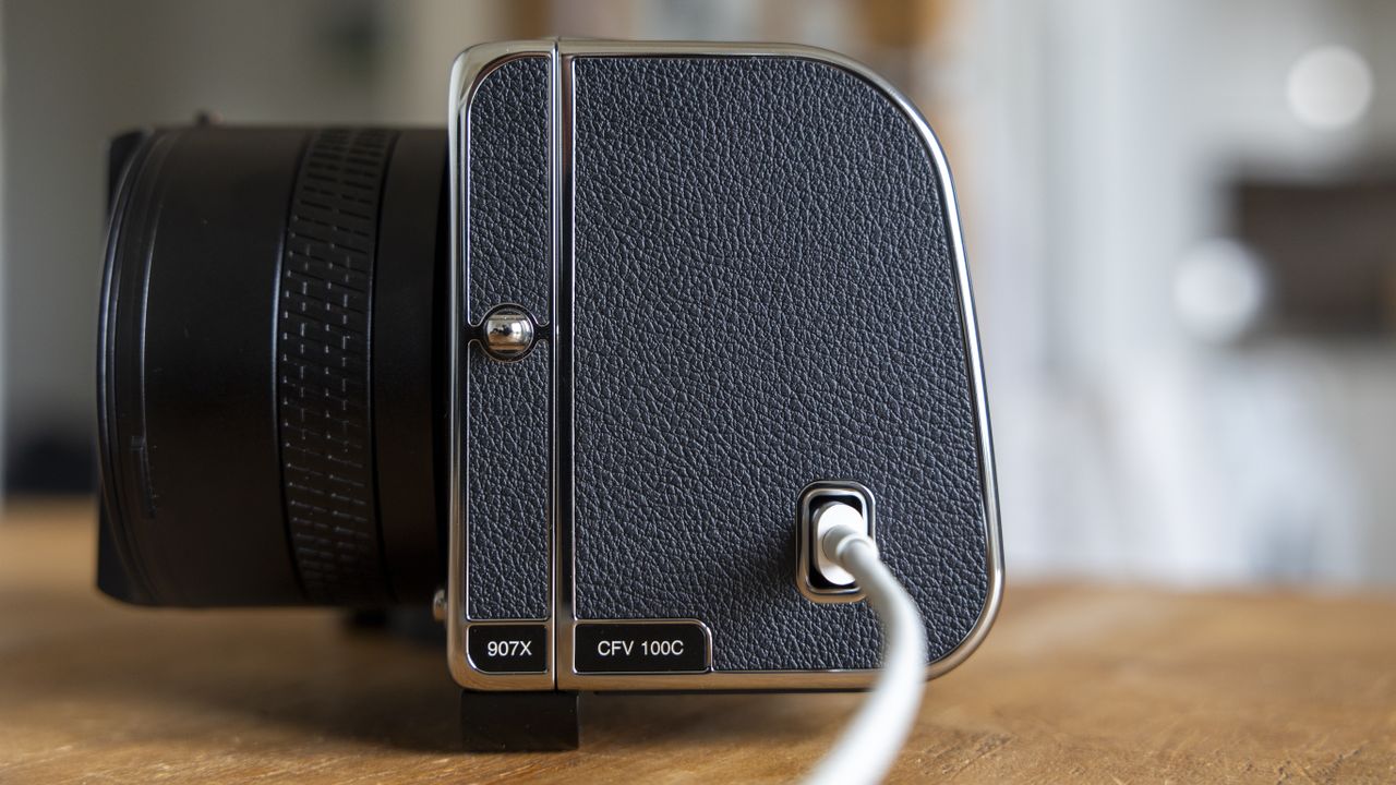 The Hasselblad 907X CFV 100C being charged via USB-C