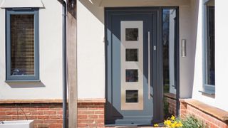 grey front door with glazed panels