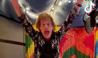 Mick Jagger throwing his hands in the hair in a still from his TikTok video