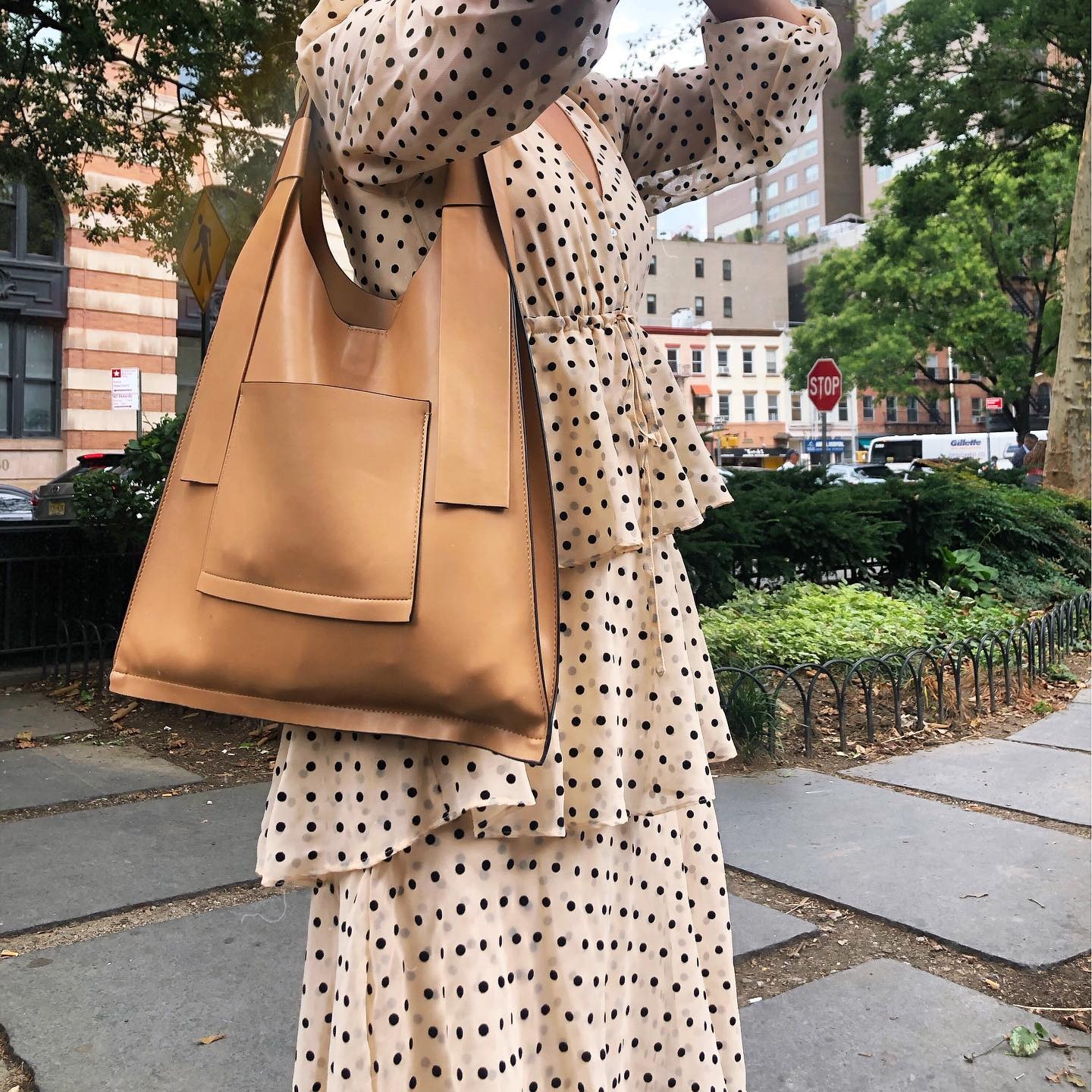vanessa wears polk dot and large tank tote bag