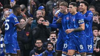 Cole Palmer of Chelsea celebrates scoring the opening goal with his team mates during the Premier League match between Chelsea FC and Fulham FC at Stamford Bridge on December 26, 2024 in London, England.