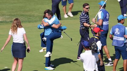 Rory McIlroy and Tommy Fleetwood of Team Europe celebrate victory following their round on the 17th green during the Friday morning foursomes matches of the 2023 Ryder Cup 