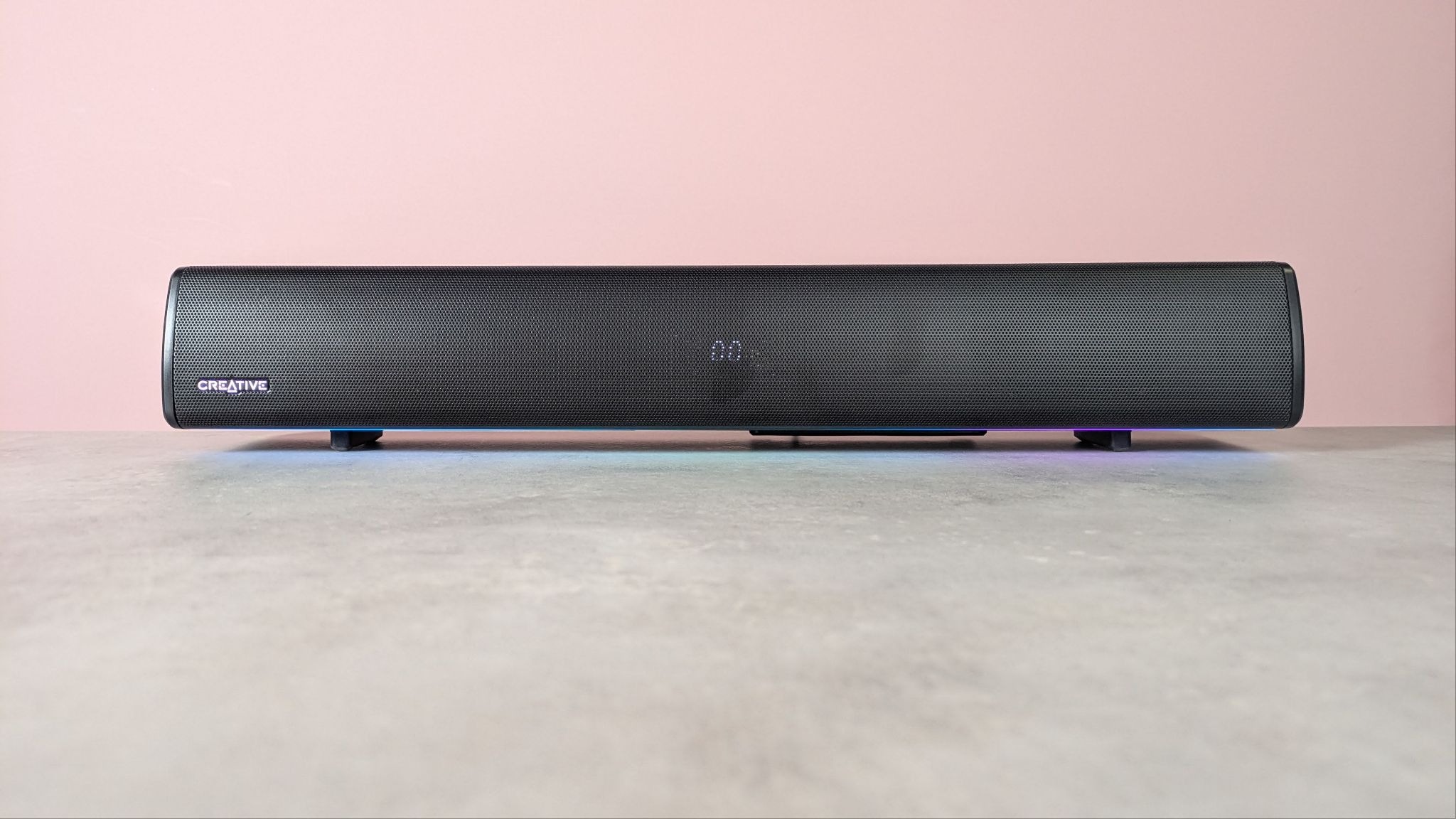 Creative Sound Blaster GS5 on a desk with pink wall in background