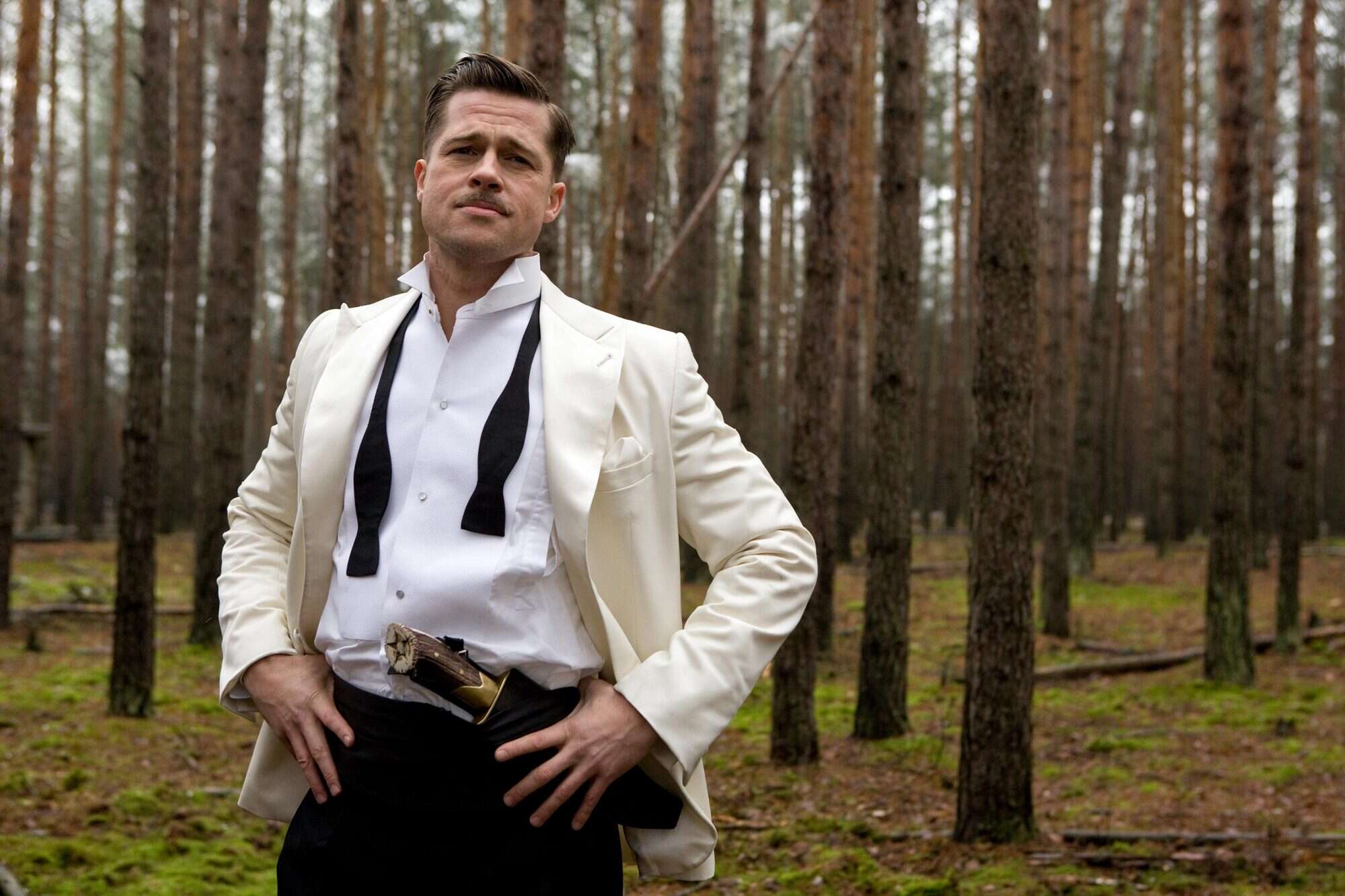 Brad Pitt standing in the woods