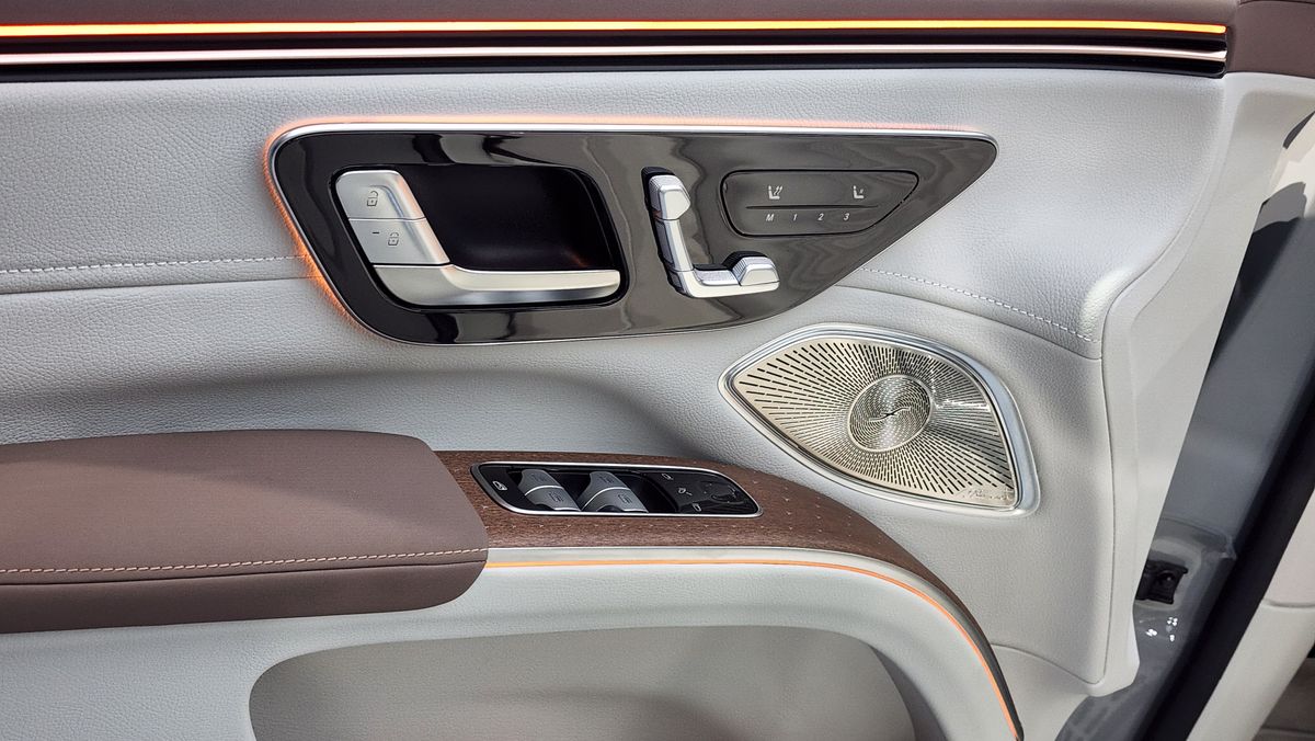 Inside driver door panel showing seat and window controls