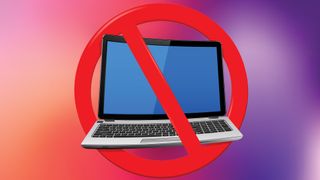 Laptop on coloured background with no entry sign