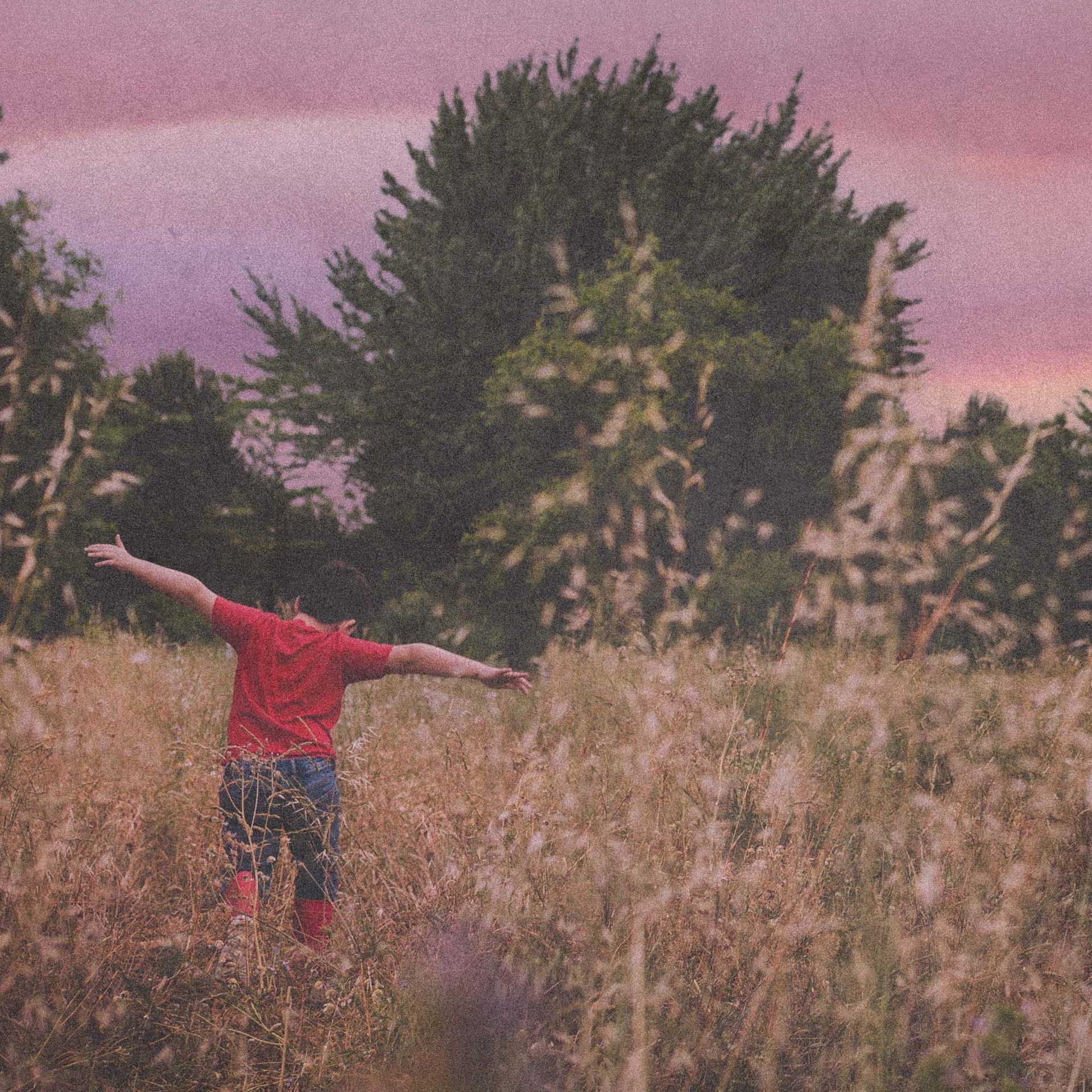 boy running in a field