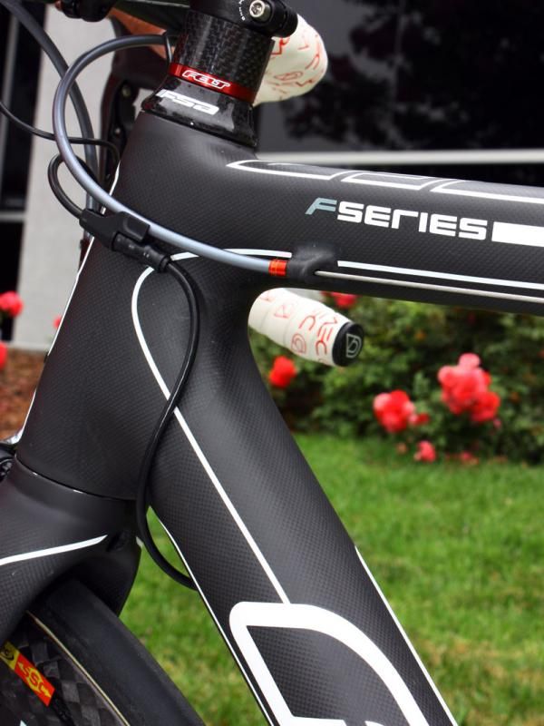 Carbon brake housing stops are molded into the top tube.