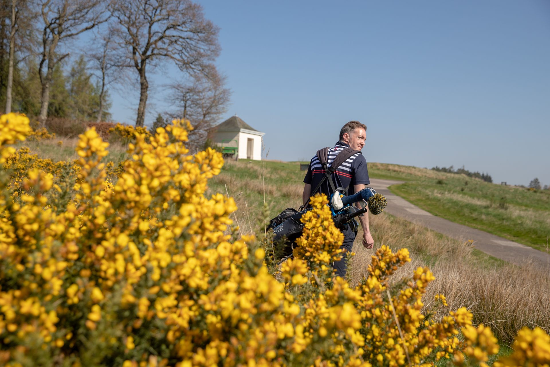 I return to the tee to play again