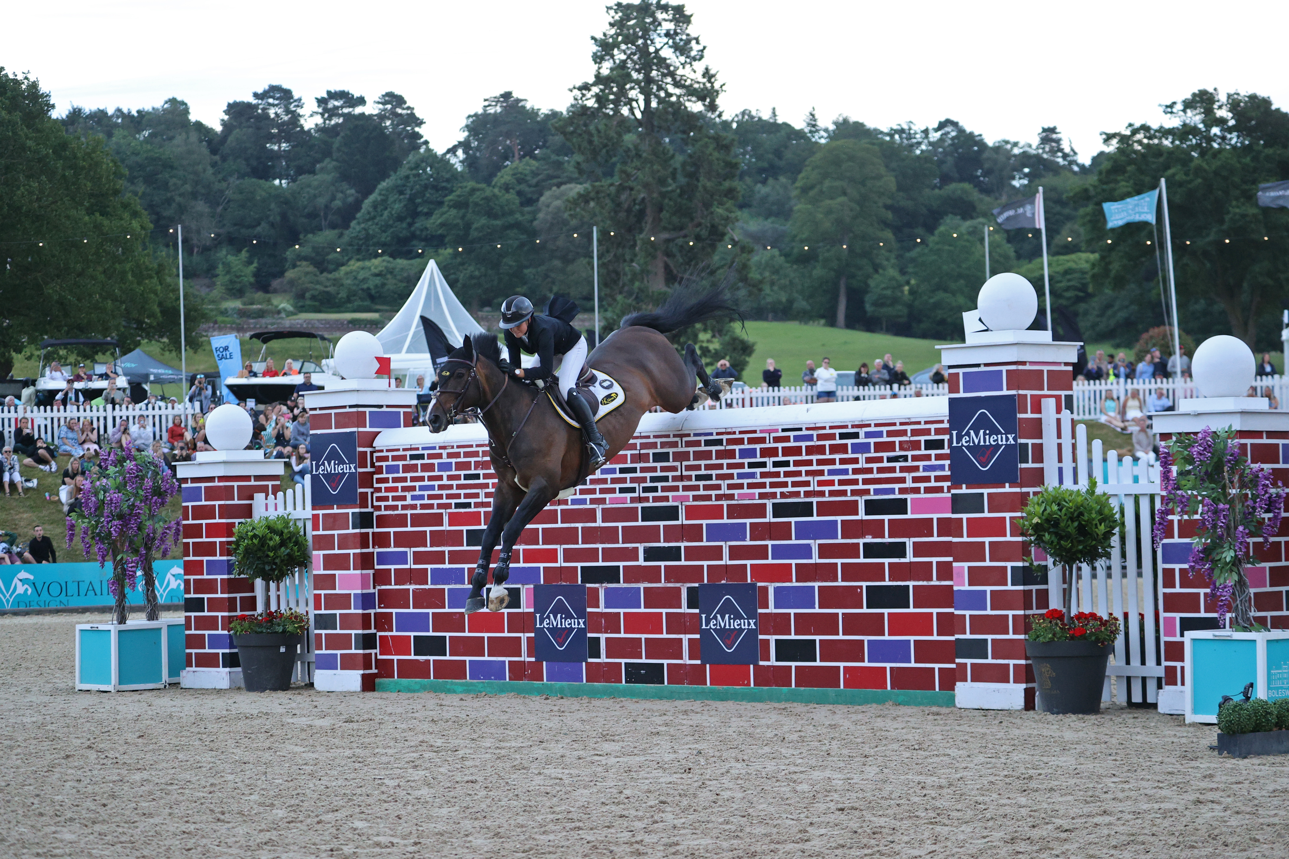 Teenager Rachel Proudley and Easy Boy De Laubry Z clear 7ft 3in to share the Bolesworth puissance spoils with Brendan Murphy riding Erne Riverrun.