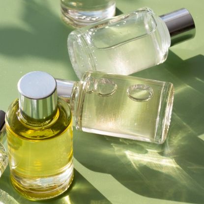 perfume bottles on a green background