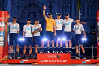 MADRID, SPAIN - SEPTEMBER 11: Alejandro Valverde Belmonte of Spain and Movistar Team celebrates with his teammates tribute to his farewell to the professional cycling on the podium ceremony and in the Plaza Cibeles with the Palacio de Cibeles - Ayuntamiento de Madrid in the background after the 77th Tour of Spain 2022, Stage 21 a 96,7km stage from Las Rozas to Madrid / #LaVuelta22 / #WorldTour / on September 11, 2022 in Madrid, Spain. (Photo by Tim de Waele/Getty Images)