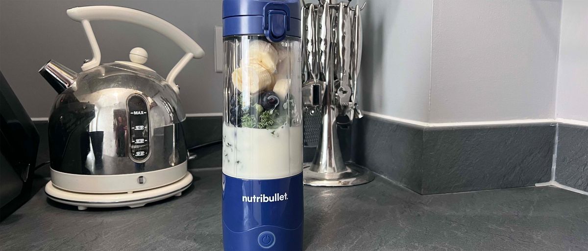 Nutribullet Magic Bullet portable blender making a banana, blueberry and kale smoothie