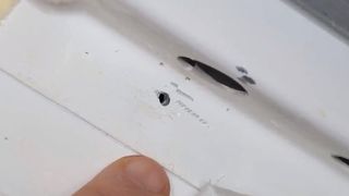A closeup image of the suspected drill hole that astronauts discovered in the Soyuz MS-09 spacecraft in 2018.