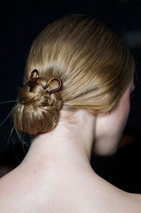 Model's hair pulled into a bun