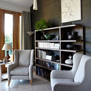 room with armchairs and bookshelves
