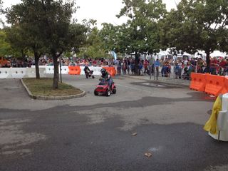 Miniature cars and motorcycles race around a track at World Maker Faire in New York on Sept. 21, 2013.