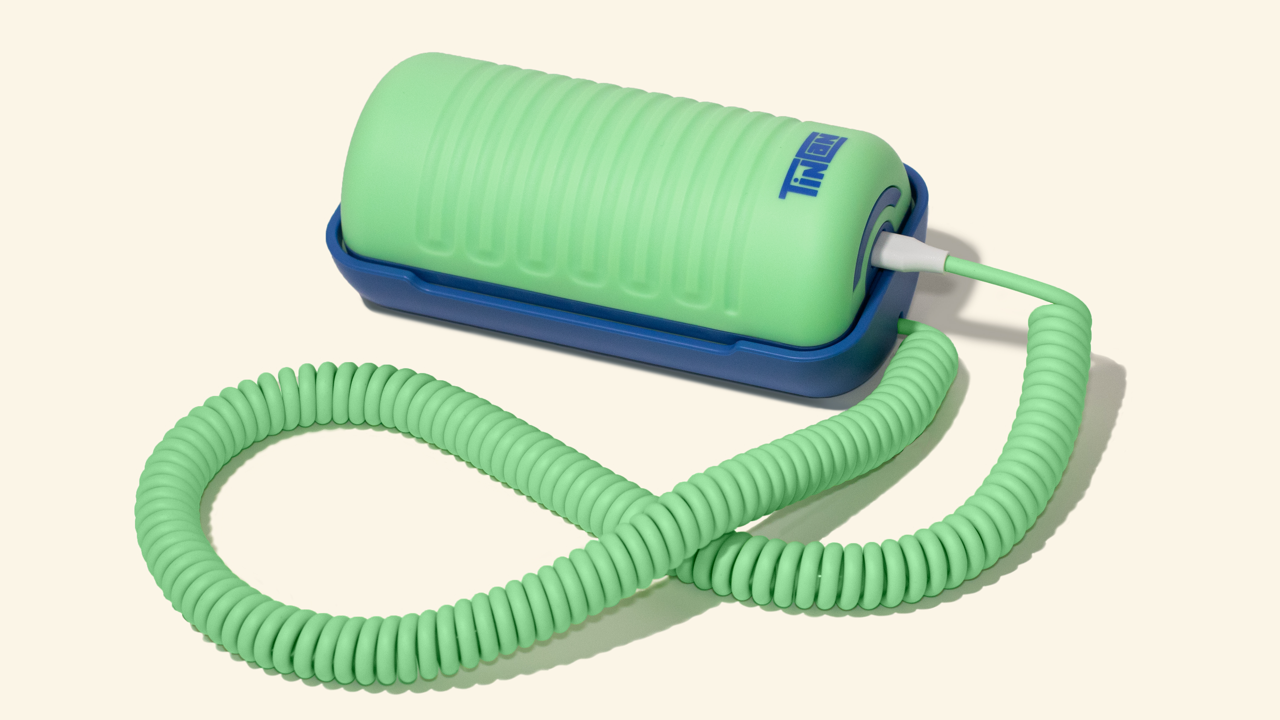 The Tin Can landline-inspired phone in a light green and blue "Answer Me Aquamarine" colorway