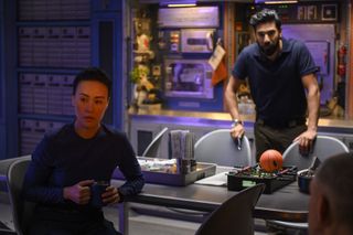 (left to right) Lu (Vivian Wu) and Ram (Ray Panthaki) work together on their way to Mars.
